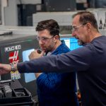 student and instructor working in CNC machining lab
