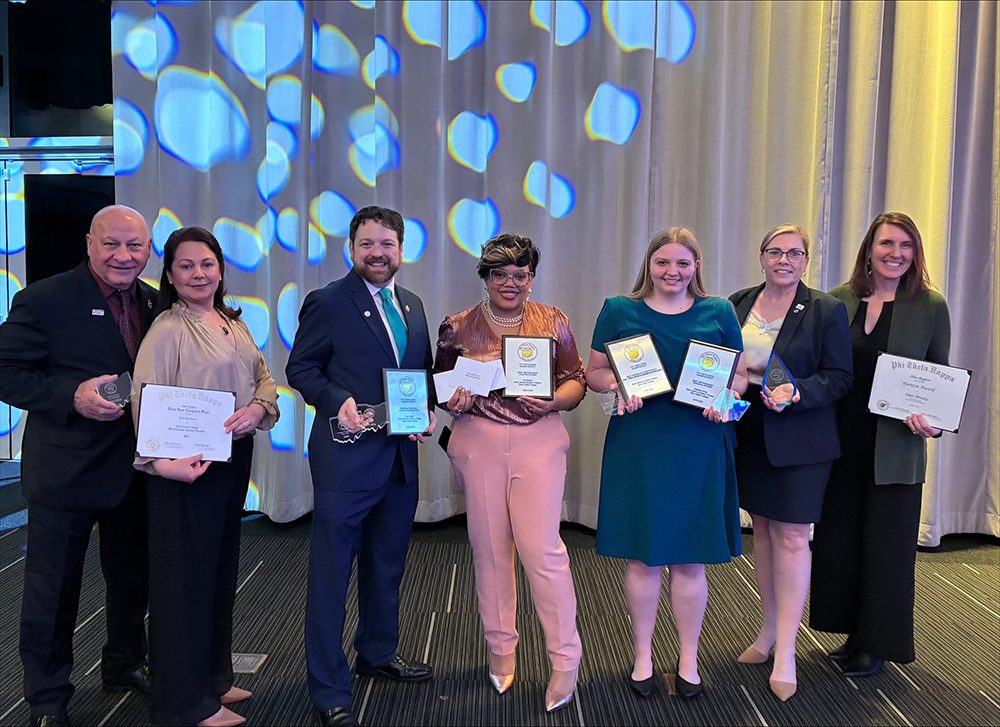 PTK Ohio Region Conference Awards, 7 recipients standing with awards