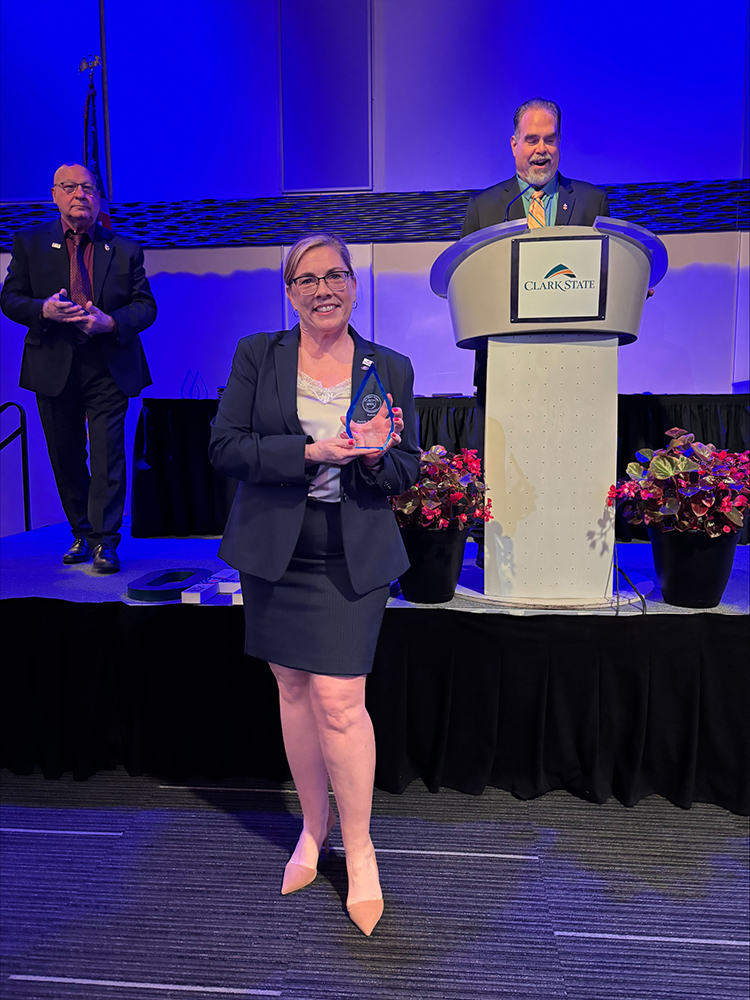 PTK Ohio Region Conference Awards, Stark State's Danette Bosh Alexander standing with award