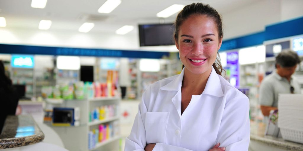 Women smiling in pharmacy store