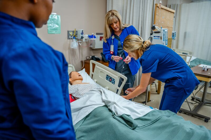 Associate degree in nursing, lab, instructor with students and simulator