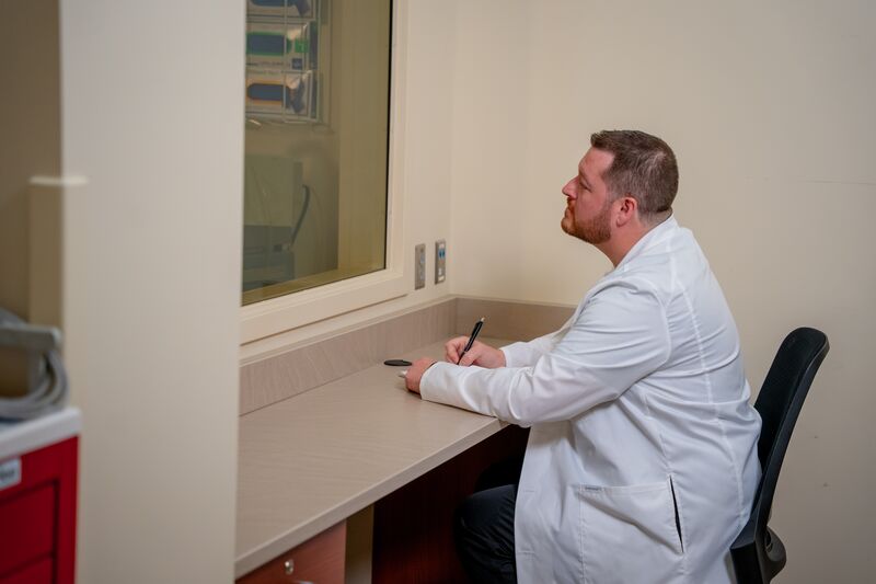 Practical Nursing, LPN, instructor watching students in lab through a two-way mirror
