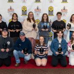 Spartan Media Award Winner, two rows of students holding their awards, smiling students