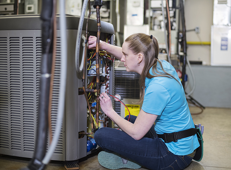 HVACR, female student working on air conditioner
