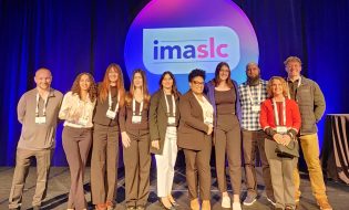 Nine IMA students and instructor pose for a group picture