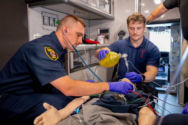 EMS students working with simulator