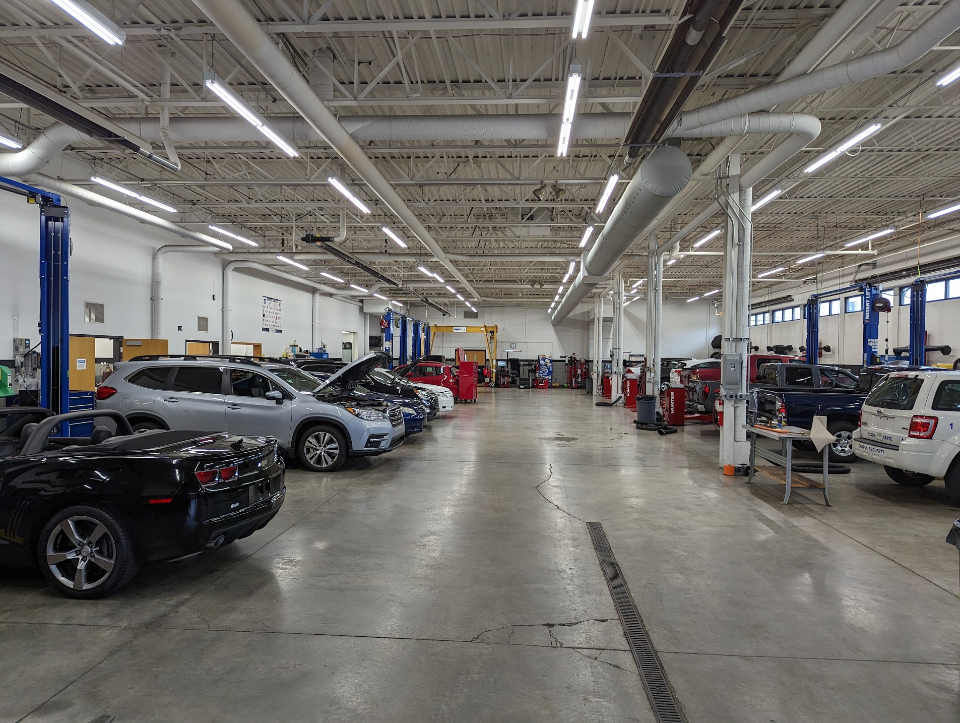 Automotive facility garage with several cars