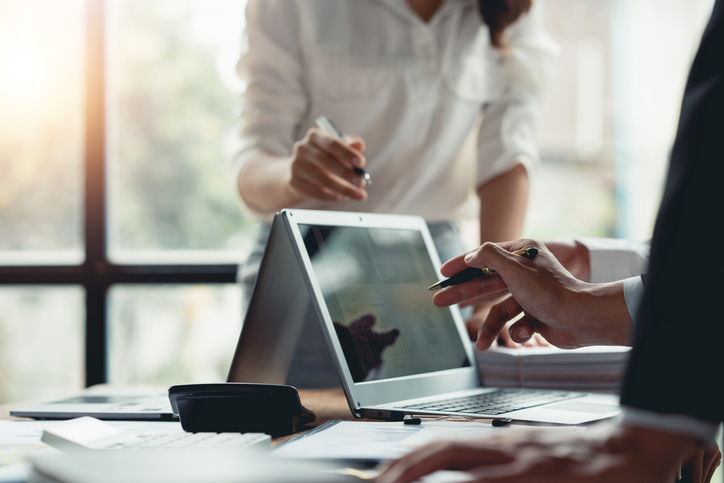 Group of business people together to brainstorm business team meeting, number, graph, chart, analyze the company's financial marketing concept. and analyze marketing strategy planning on laptop.