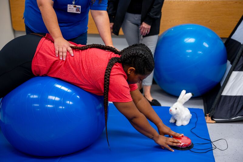 Occupational therapy, two students working with balance ball