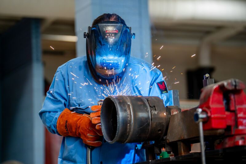 Welding student conducting welding demonstration