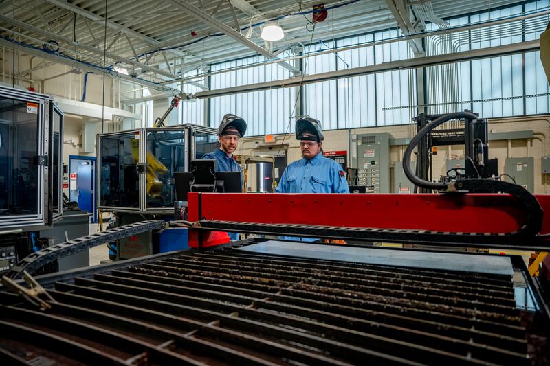 Welding student and instructor conducting welding demonstration