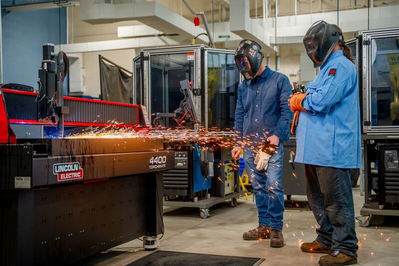 Welding student and instructor conducting welding demonstration