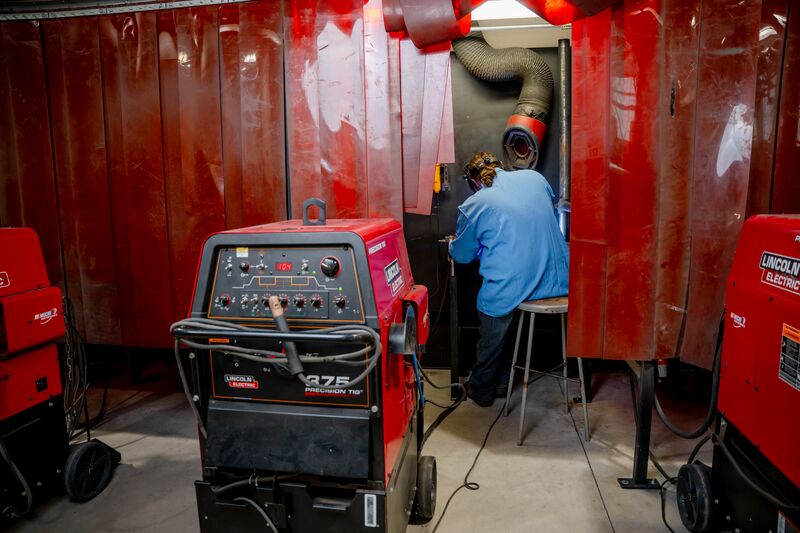 Welding student conducting welding demonstration