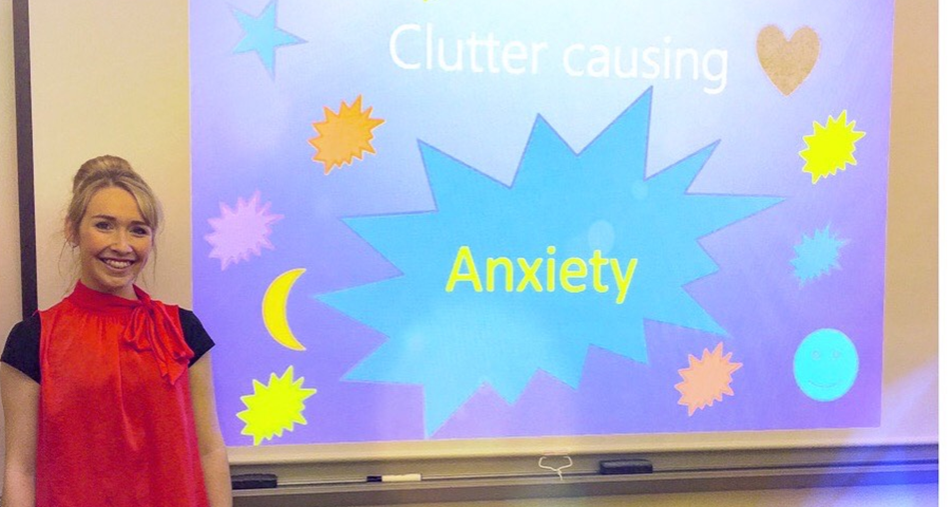 Natalie James in front of her presentation